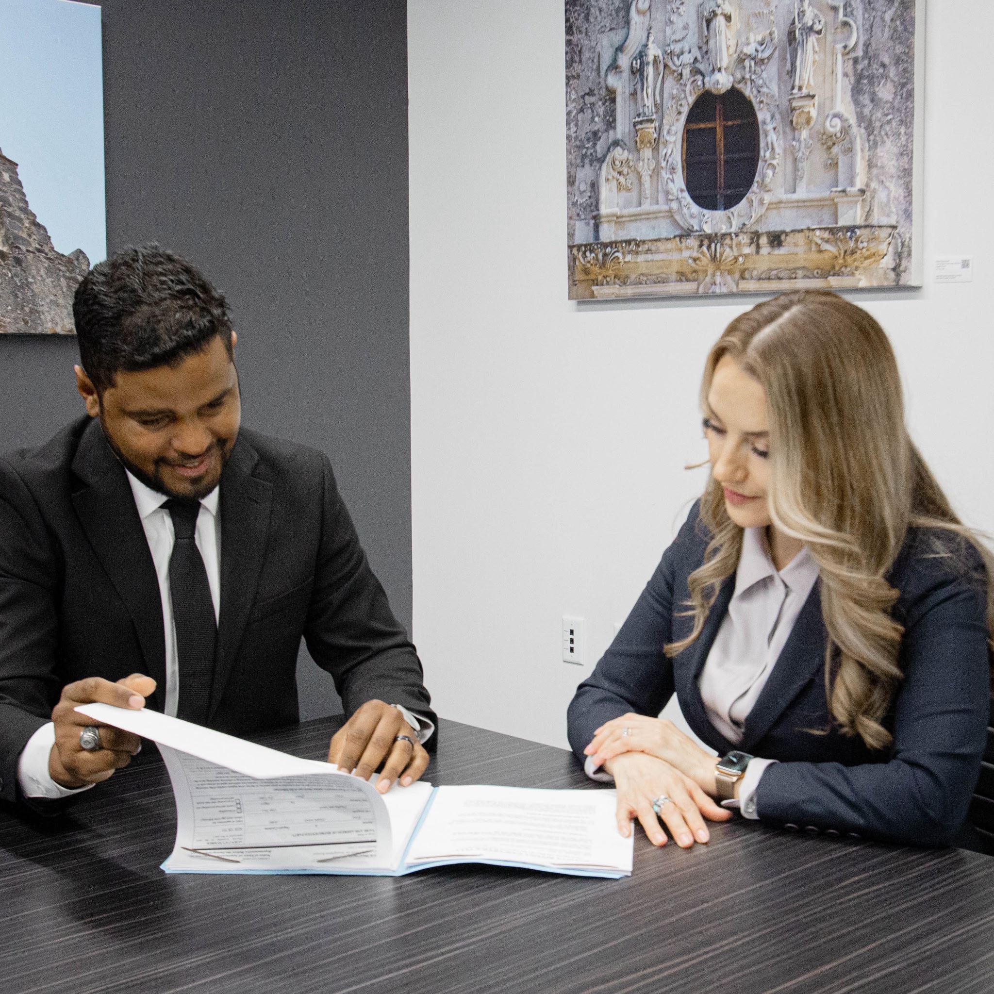 Batista Rivera Law Office team reviewing a case together